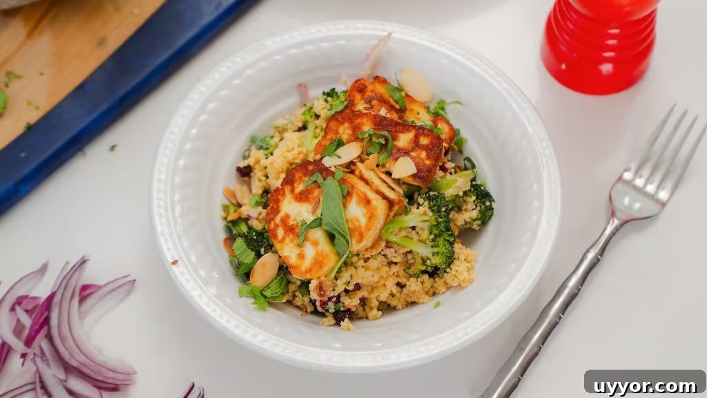Roasted Broccoli and Halloumi Salad in a white porcelain bowl. The Halloumi cheese 