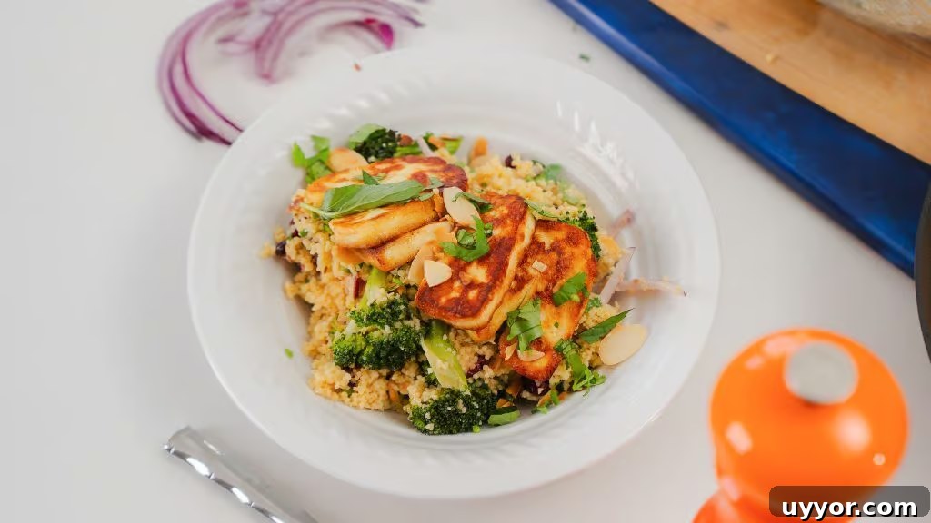 Roasted Broccoli and Halloumi Salad in a white porcelain bowl. The Halloumi cheese 