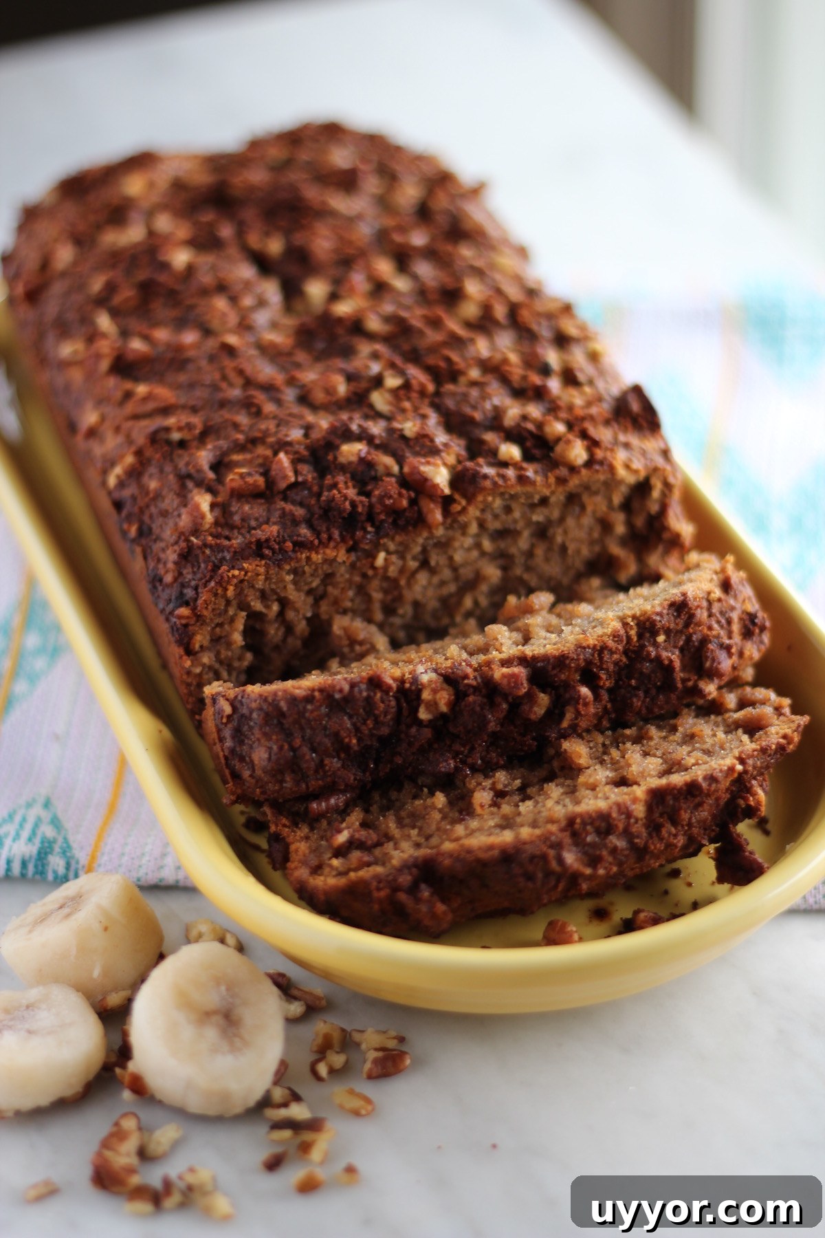 Grain-Free Streusel Banana Bread- a paleo, gluten-free banana bread loaded with pecan cinnamon streusel on top! Delicious for breakfast or dessert! | fedandfulfilled.com