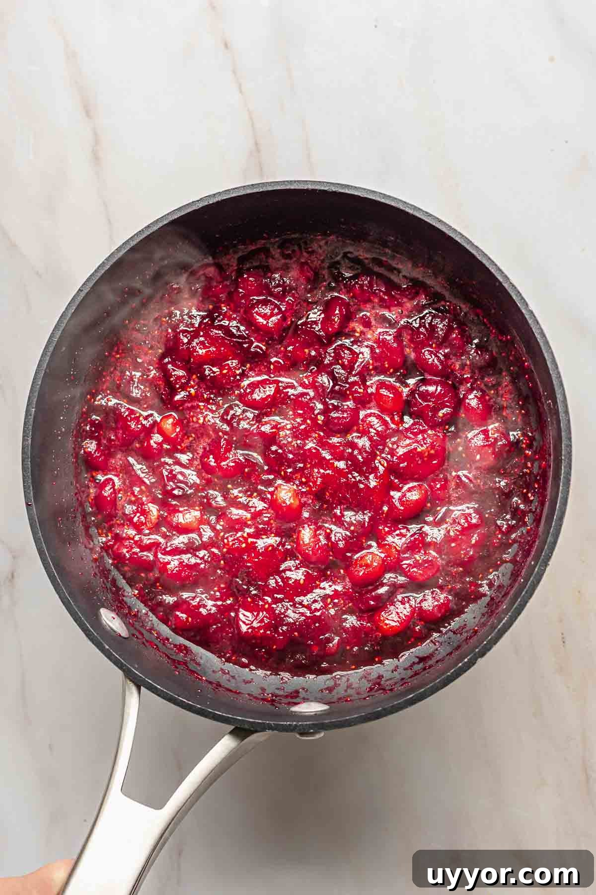 Cooked cranberries in a pot.