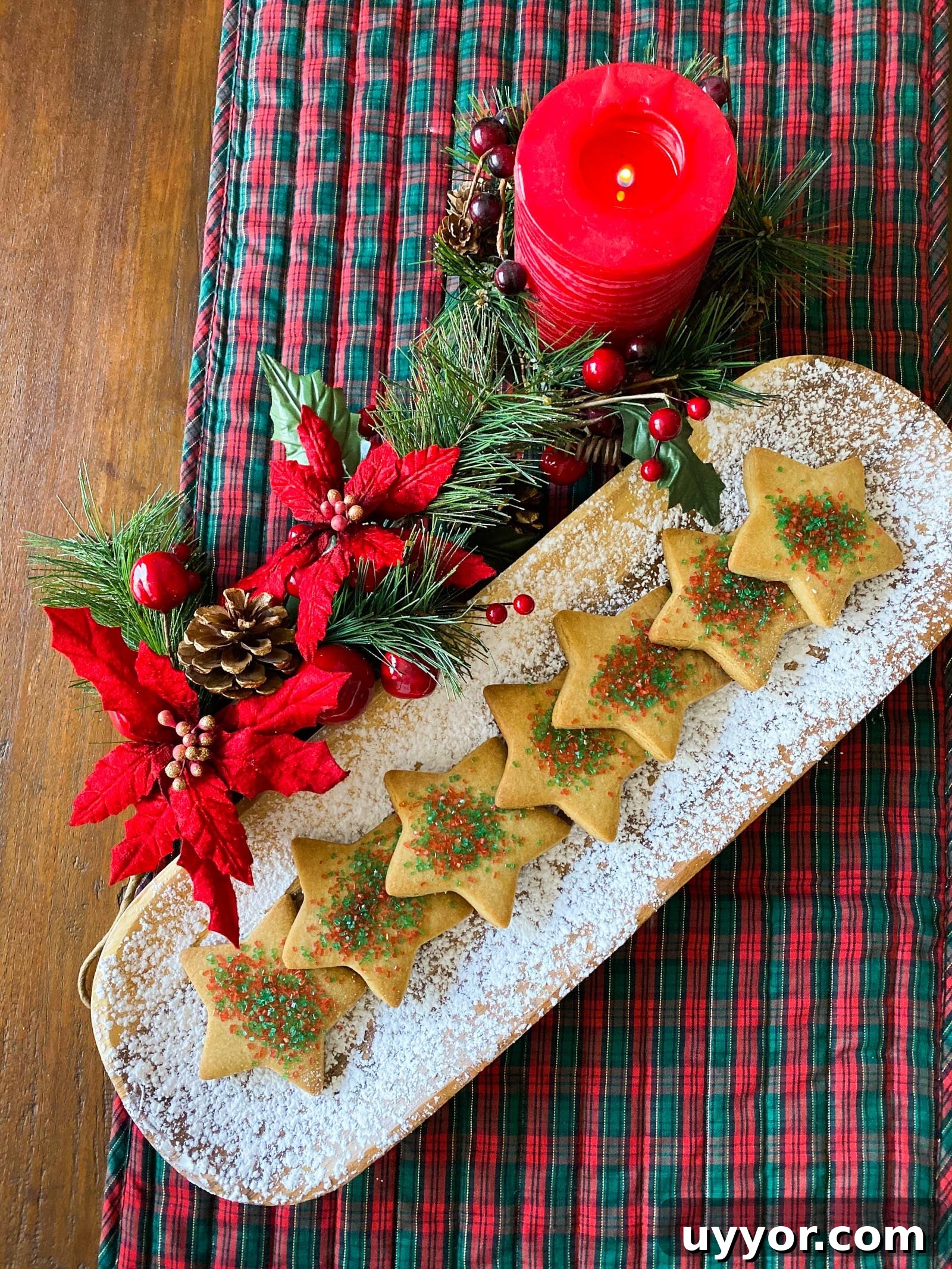 Chewy Brown Sugar Cookie Recipe You’ll Love 4 brown sugar cookies on a white dish with christmas holly around it and a red candle