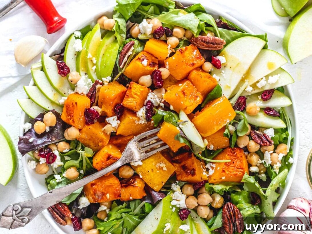 25 Cozy Apple Recipes That Capture Fall Flavors 21 butternut squash salad with a silver fork