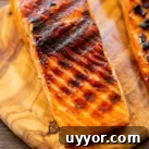 Grilled Salmon filet on wood cutting board