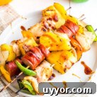 Chicken and Sausage Kebabs on white plate