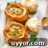 bread bowls of cheeseburger soup on platter.