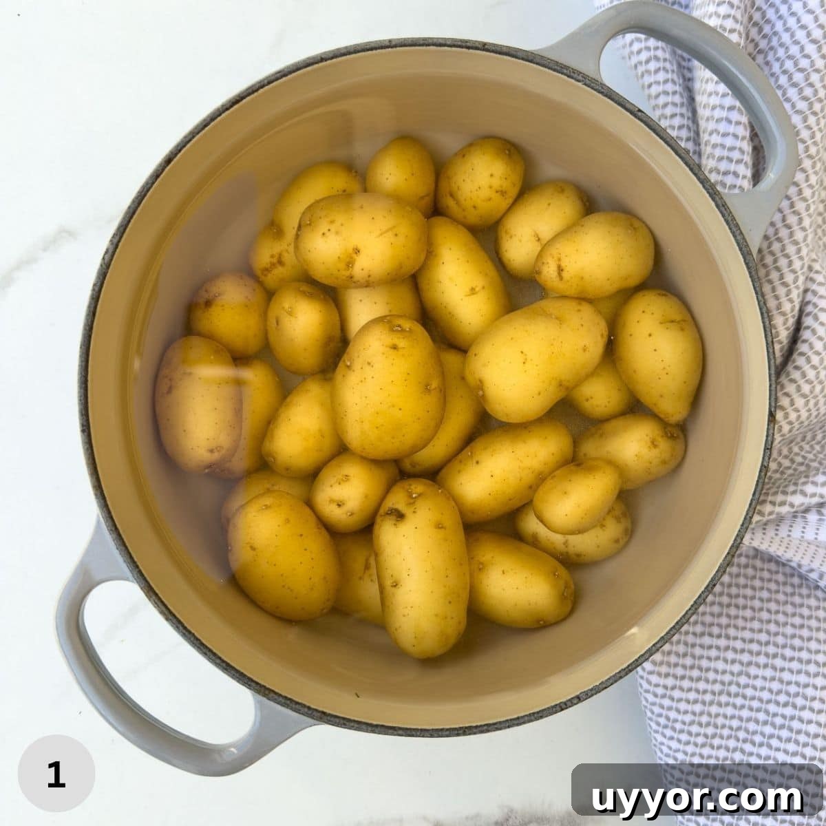 Buttery Baby Dutch Yellow Potatoes Recipe for Tender Roasted Spuds 4 Cooking baby dutch potatoes in a gray pot.
