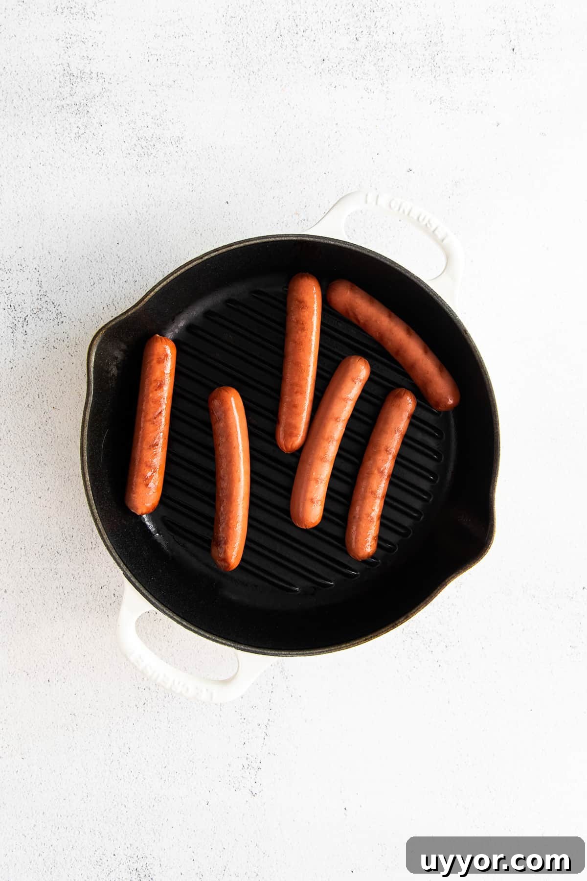 Seared hot dogs Seared hot dogs in pan.