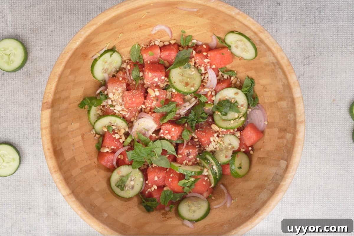 Authentic Thai Watermelon Salad Recipe for Summer Flavor 6 Roasted crushed peanuts, mint and Thai basil sprinkled over ready Thai watermelon salad.