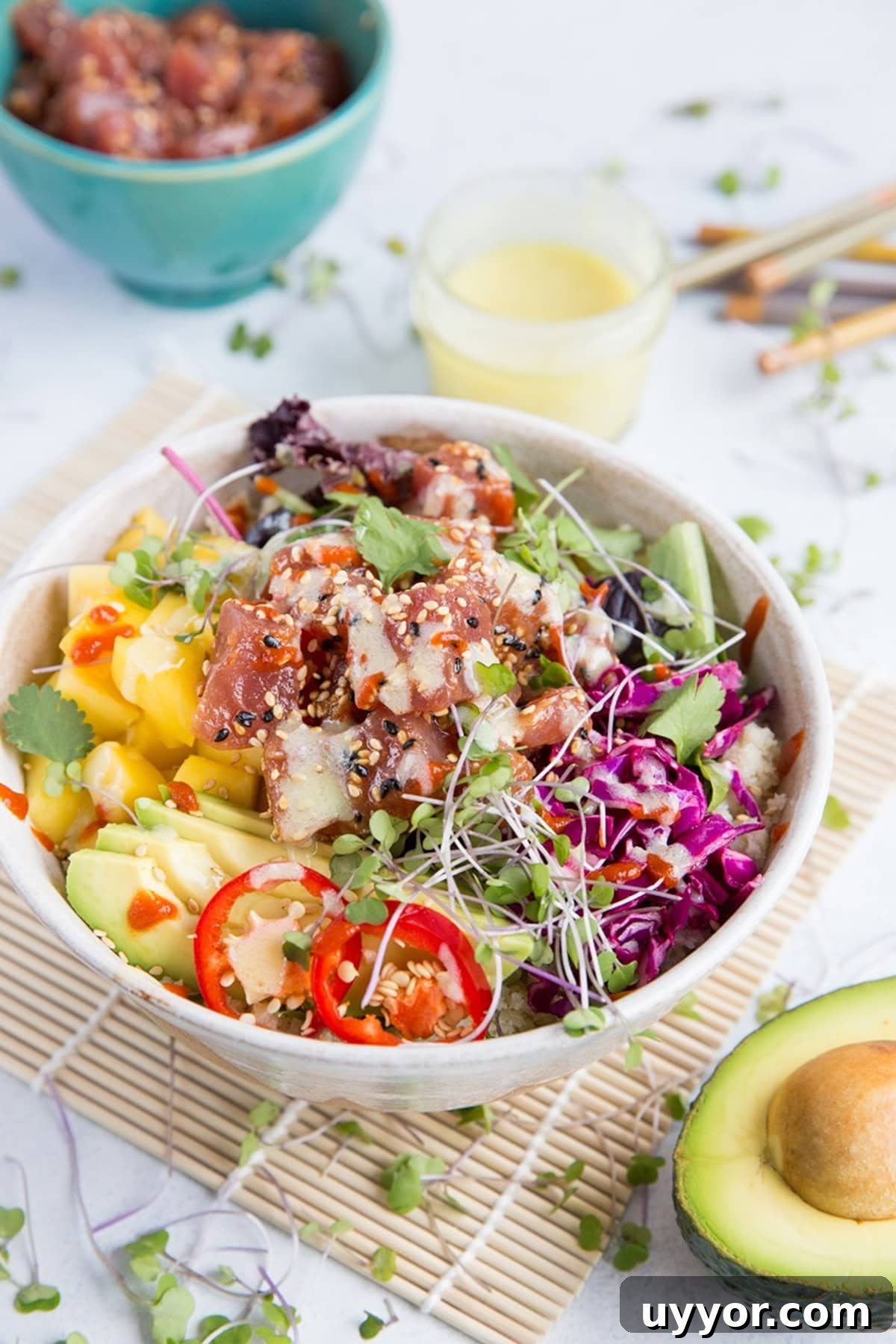 Ahi Poke Sushi Bowls with Wasabi Mayo, mango, avocado, microgreens, rice, and more.