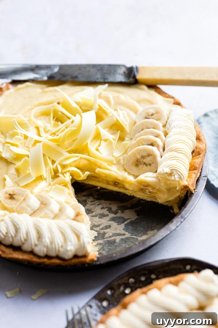 banana cream pie with slice removed