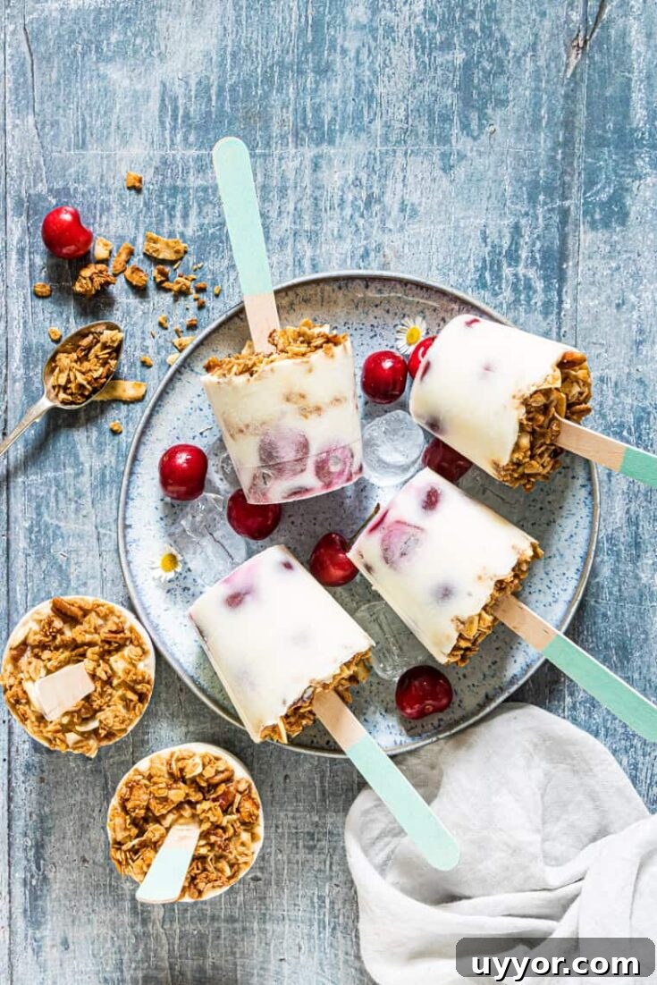 cherry yogurt popsicles served on a plate