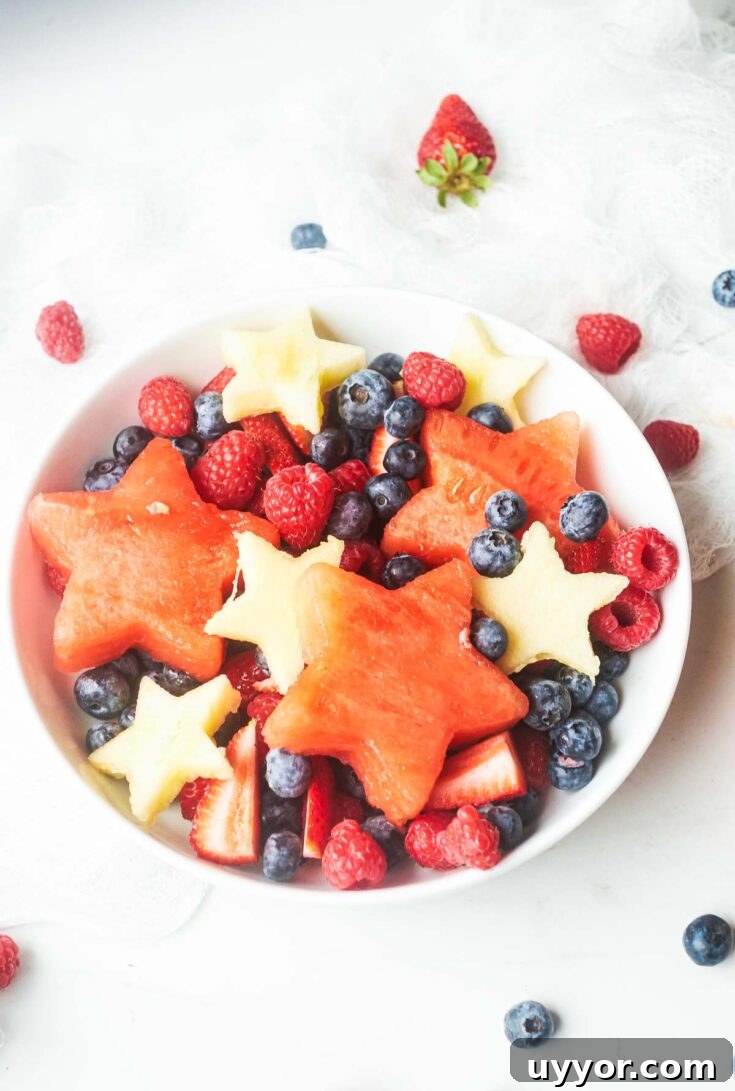 red white and blue fruit salad in bowl
