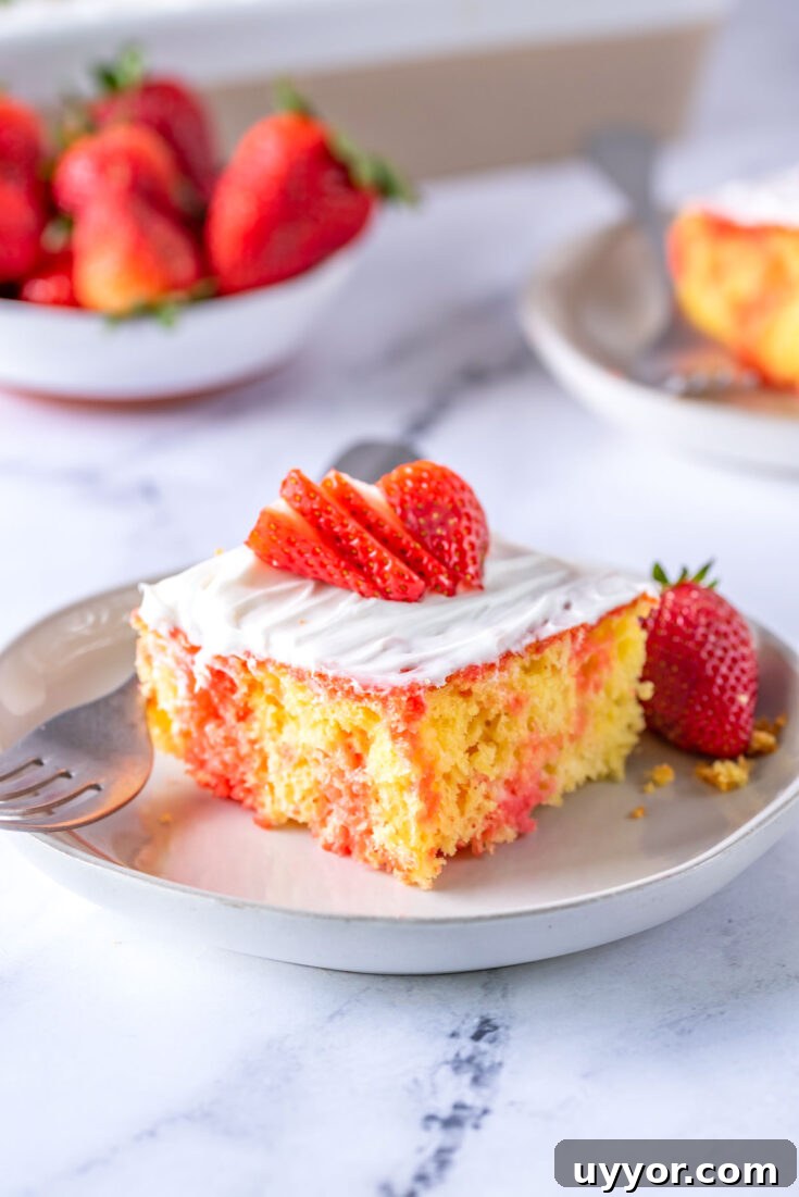 slice of strawberry poke cake