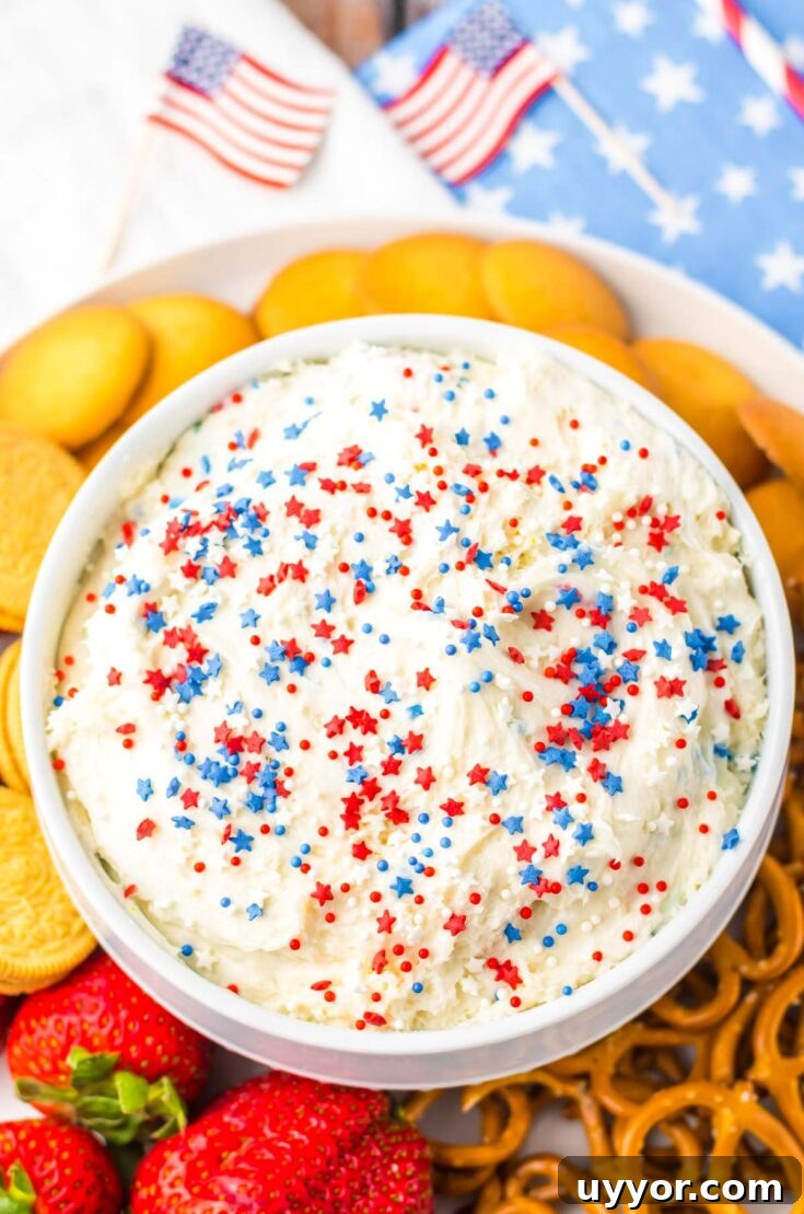 funfetti dip in a white bowl surrounded by dippers