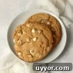 Single serve white chocolate macadamia nut cookie on a plate.