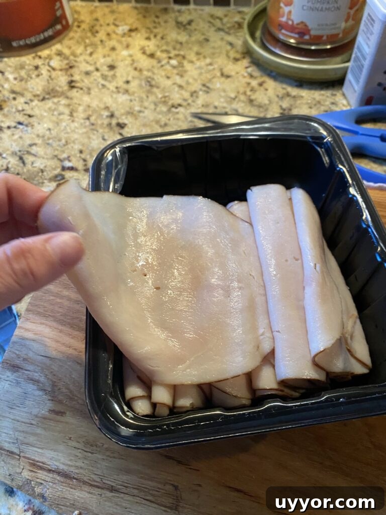 Creamy-Gravy Stuffed Turkey Roll-Ups for Holiday Dinner 3 An open package of deli turkey