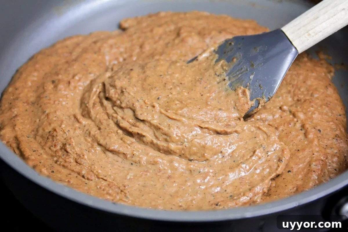 Bean mixture in a skillet.
