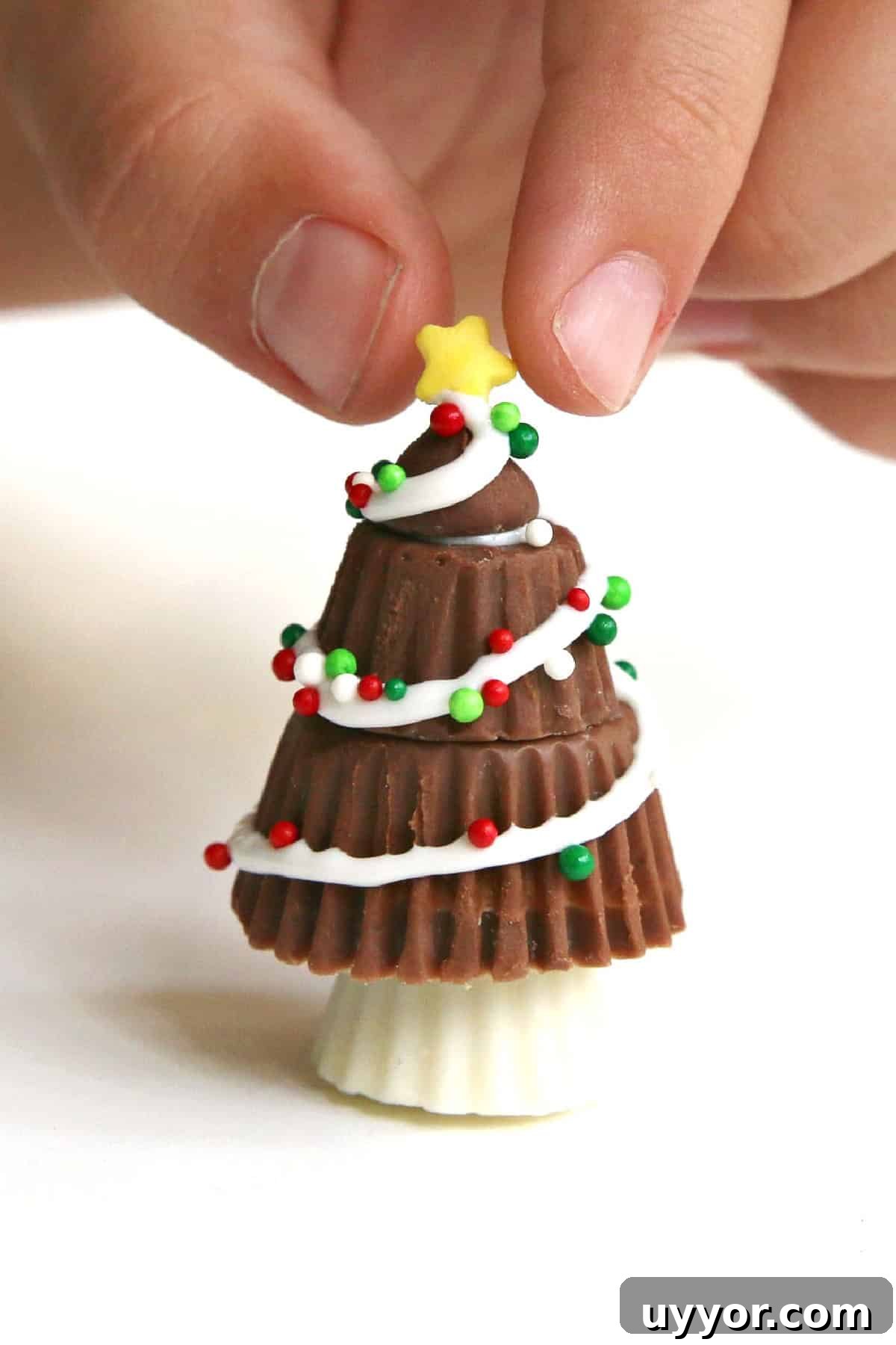 These Reese's Peanut Butter Cup Christmas Trees are so fun and easy to make. Reese's Peanut Butter Cup Christmas Trees