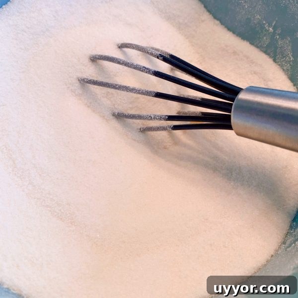 Classic Depression-Era Water Pie Recipe You Can Make Today 5 Flour and Sugar in a small bowl being whisked together.