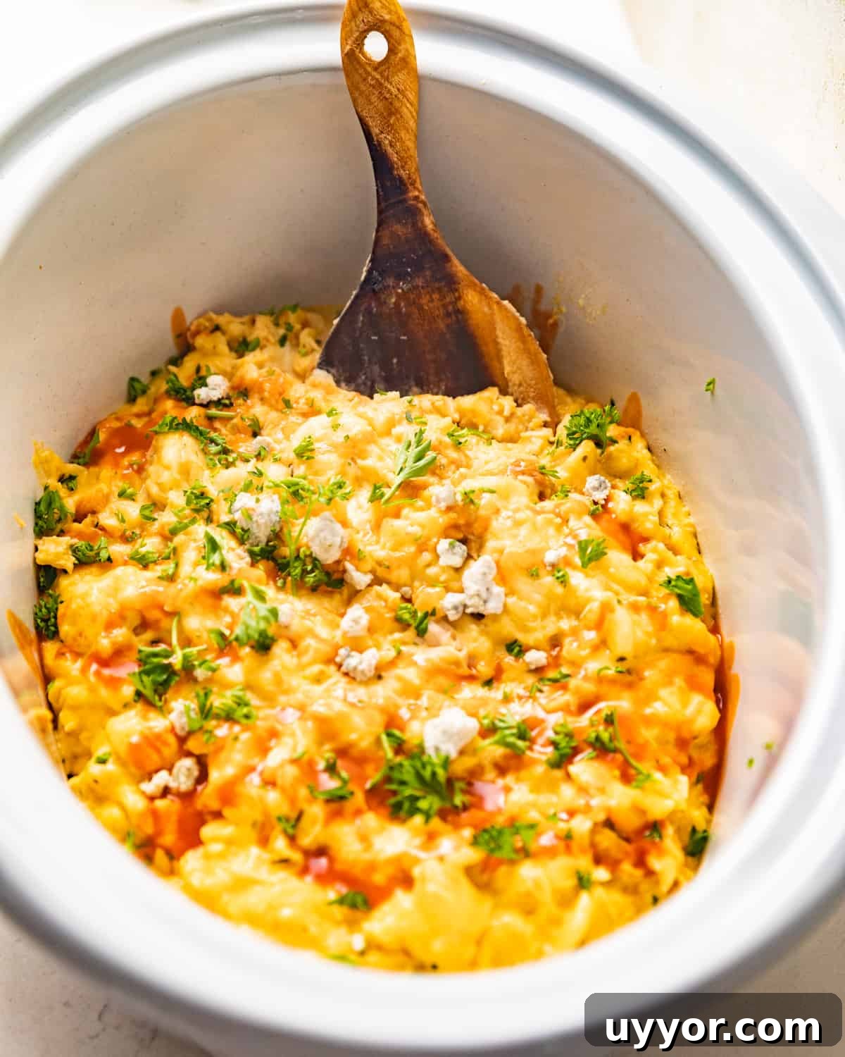 crockpot buffalo chicken mac and cheese in a crockpot.