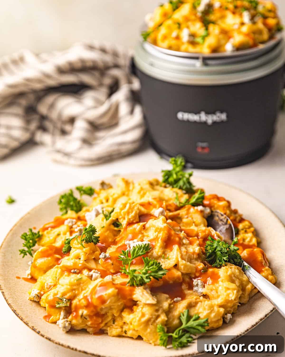 mac and cheese on a plate with a fork.