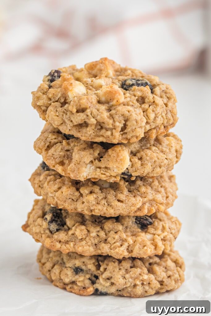 A stack of five white chocolate chip pumpkin cookies.