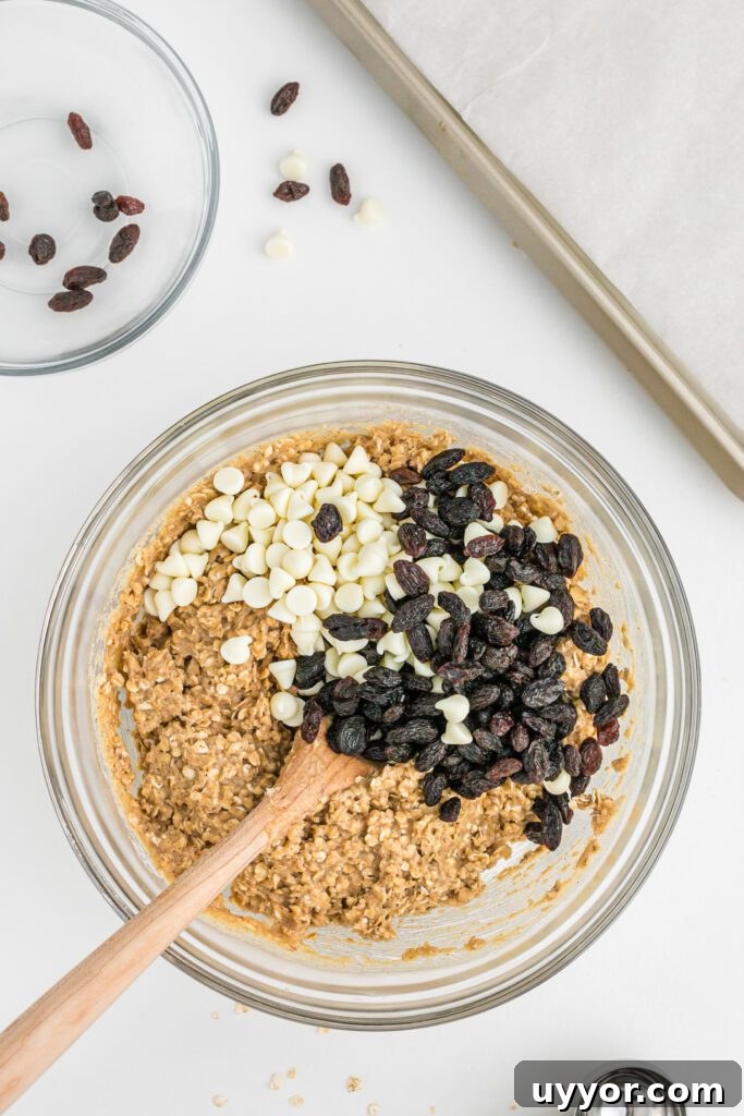 White chocolate chips and raisins for pumpkin cookie batter.
