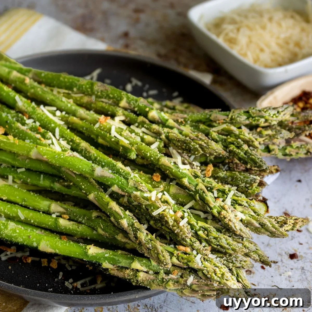 75 Foods That Start With A: Complete A-to-Z List of A Foods 4 air fryer asparagus on a plate.
