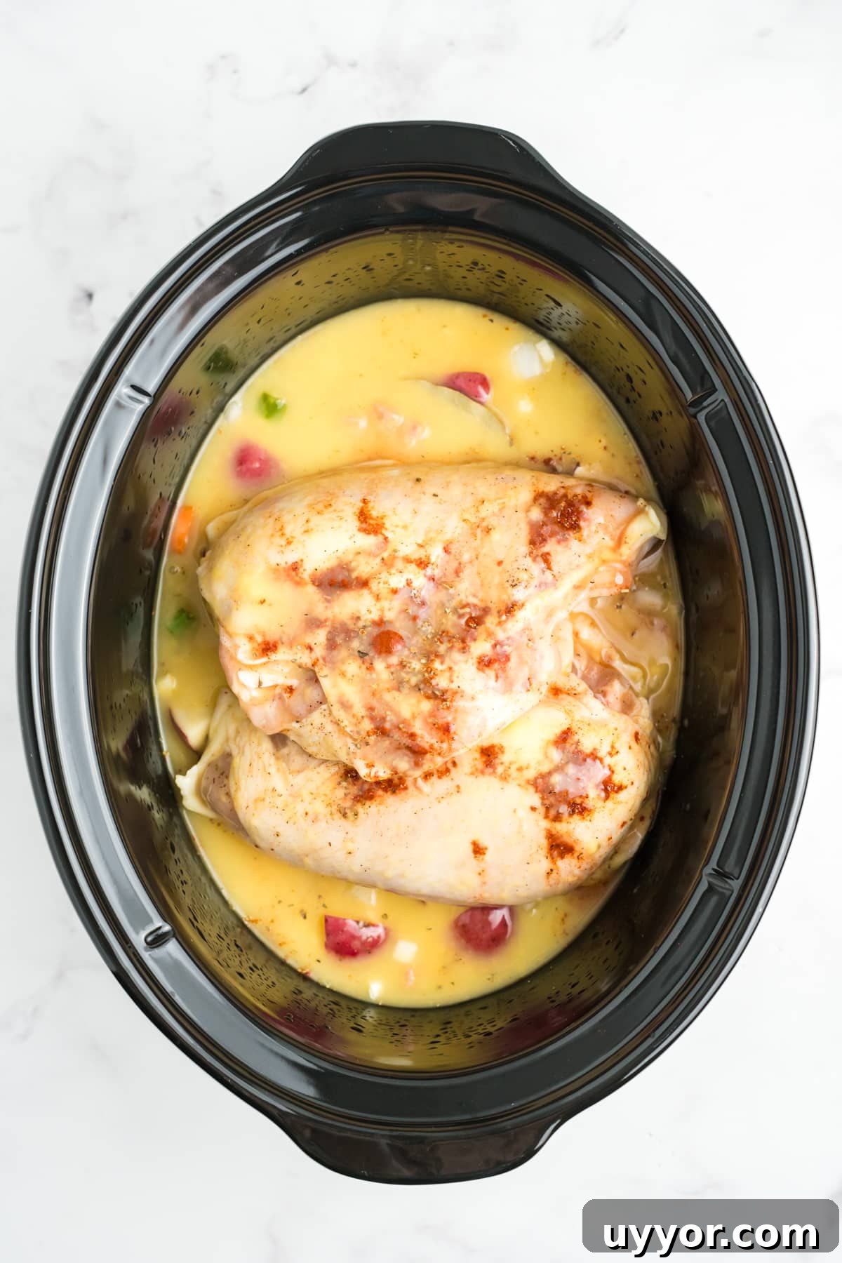 Sauce added to the slow cooker over the chicken and vegetables. 
