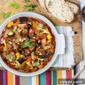 Grilled Caponata: Smoky Sicilian Eggplant with Bold Flavor 14 Grilled caponata in a vintage baking dish with oregano and pine nuts