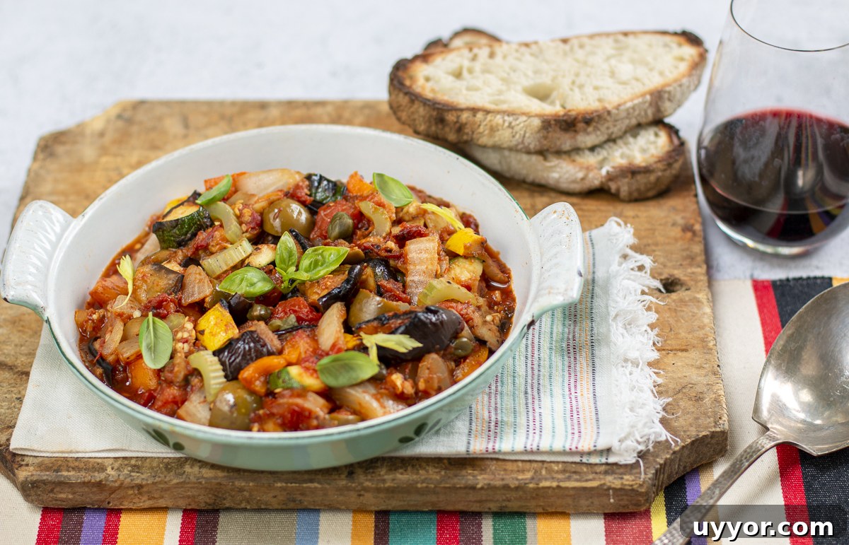 Grilled Caponata: Smoky Sicilian Eggplant with Bold Flavor 3 Grilled Caponata in a vintage baking pan with basil