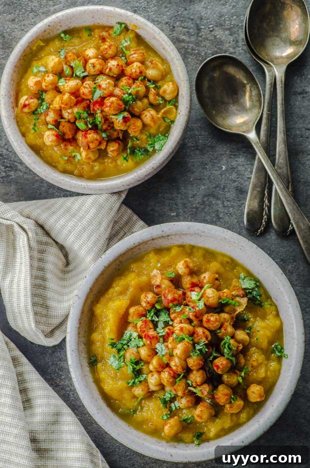 Birds eye view of two bowls of Mashed Butternut Squash with Spiced Chickpeas