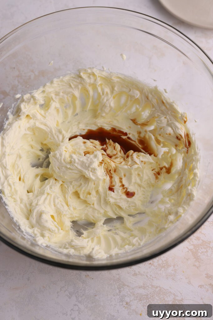Moist Pumpkin Olive Oil Cake with Cinnamon Glaze 12 Butter and cream cheese and vanilla extract in a mixing bowl.