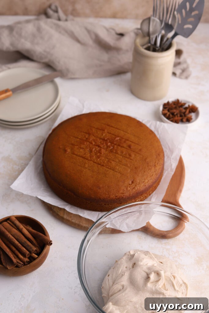 Moist Pumpkin Olive Oil Cake with Cinnamon Glaze 14 Pumpkin cake, a bowl of frosting, little plates, and cinnamon sticks.