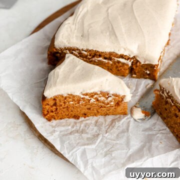 Moist Pumpkin Olive Oil Cake with Cinnamon Glaze 21 Pumpkin cake with cream cheese frosting cut into slices.
