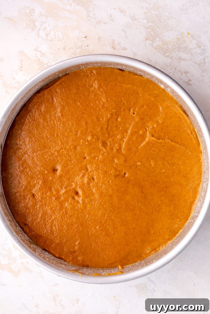 Moist Pumpkin Olive Oil Cake with Cinnamon Glaze 10 Pumpkin cake batter in a round pan.