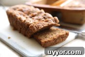 Hearty Ham Bone and Lentil Soup Recipe for Deep Flavor 14 Small cutting board with a sliced loaf of banana bread.