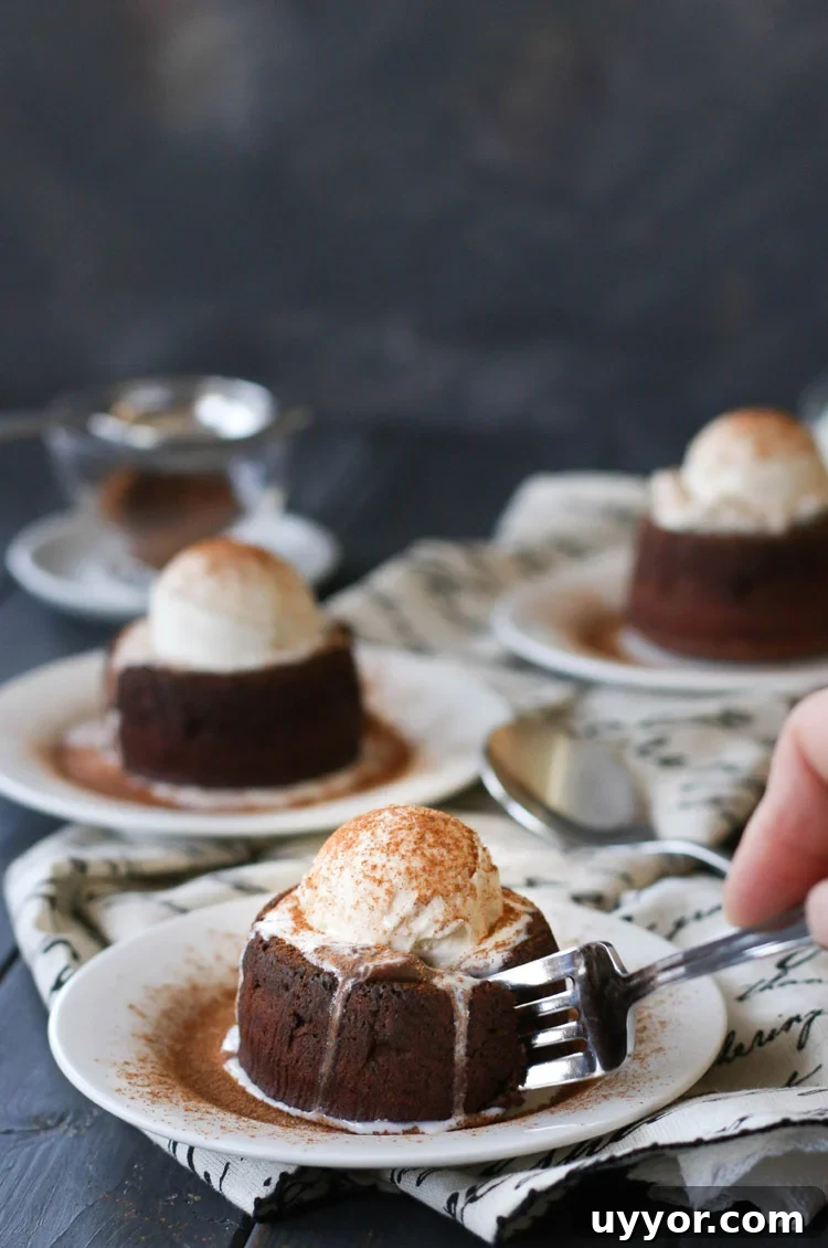 Spicy Chocolate Lava Cakes with Molten Centers 15 a fork cutting into a spicy molten chocolate lava cake