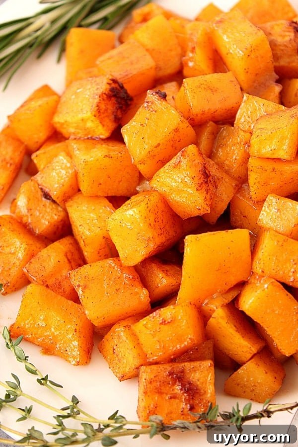 Cubed and roasted squash on a plate.
