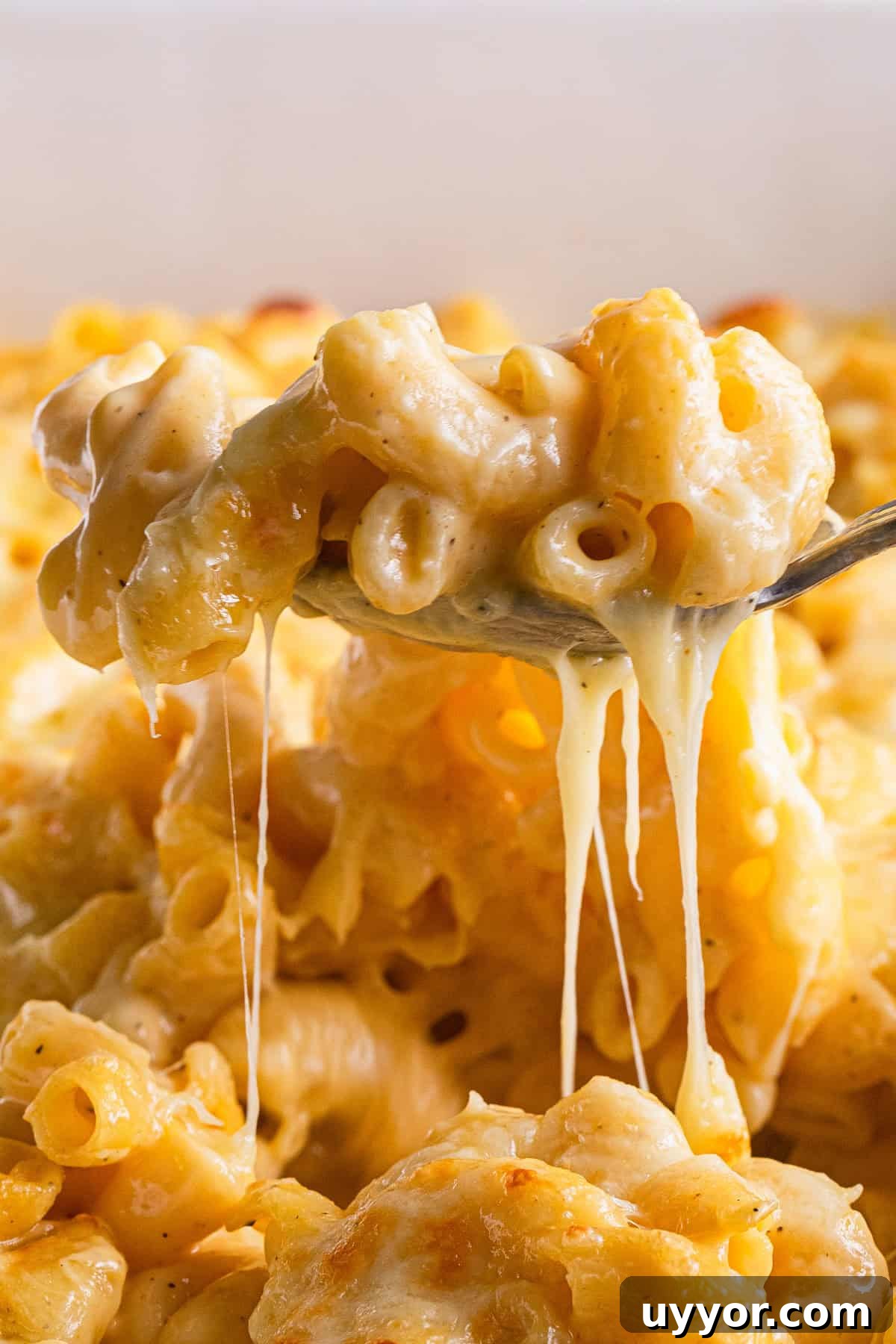 The completed baked mac and cheese scooped out of the dish.