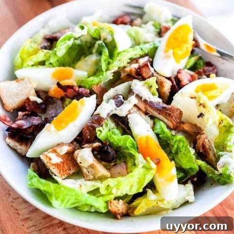 Make this classic chicken caesar salad with some egg and anchovies. Great to serve for lunch or dinner and really easy to make.