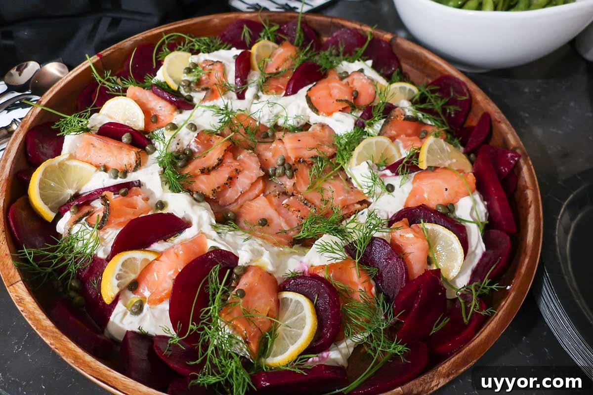 44 Gluten-Free Appetizers for Entertaining: 2026 Party Recipes 11 Scandinavian-style smoked salmon dip topped with roasted beets, fresh dill, and lemon slices on a serving platter — a colorful gluten-free appetizer.