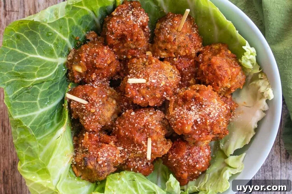 44 Gluten-Free Appetizers for Entertaining: 2026 Party Recipes 15 baked Italian meatballs in a bowl lined with cabbage leaf