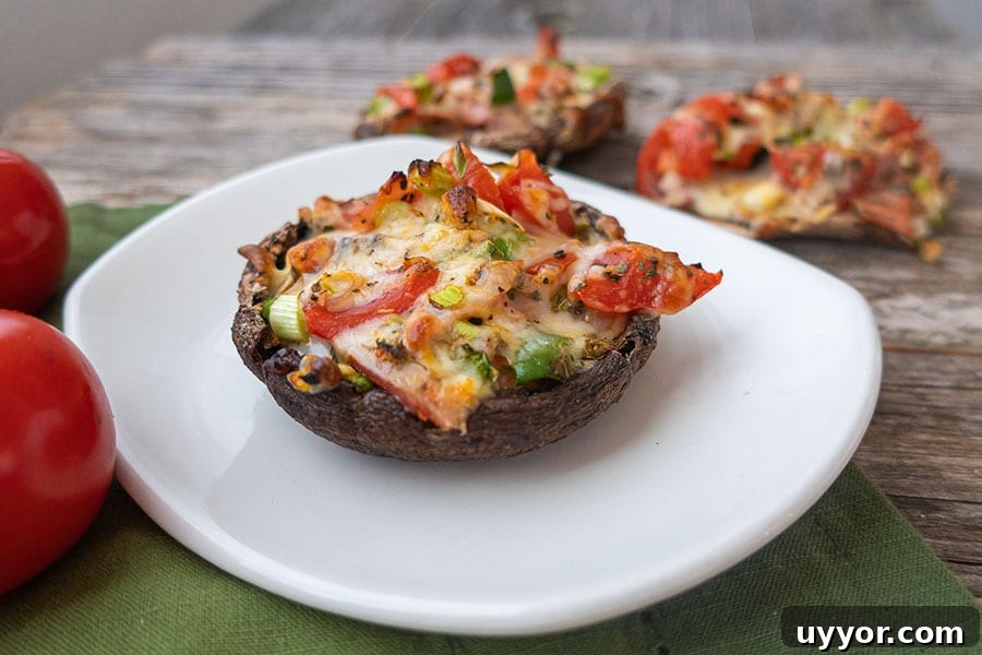 44 Gluten-Free Appetizers for Entertaining: 2026 Party Recipes 20 pizza stuffed portobello on a small plate