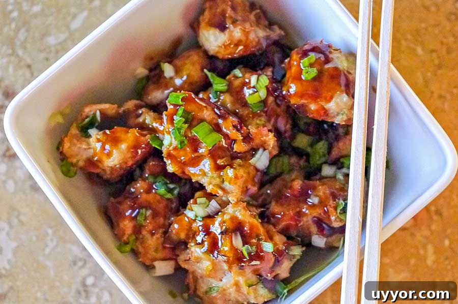 44 Gluten-Free Appetizers for Entertaining: 2026 Party Recipes 8 asian meatballs in a bowl with chopsticks