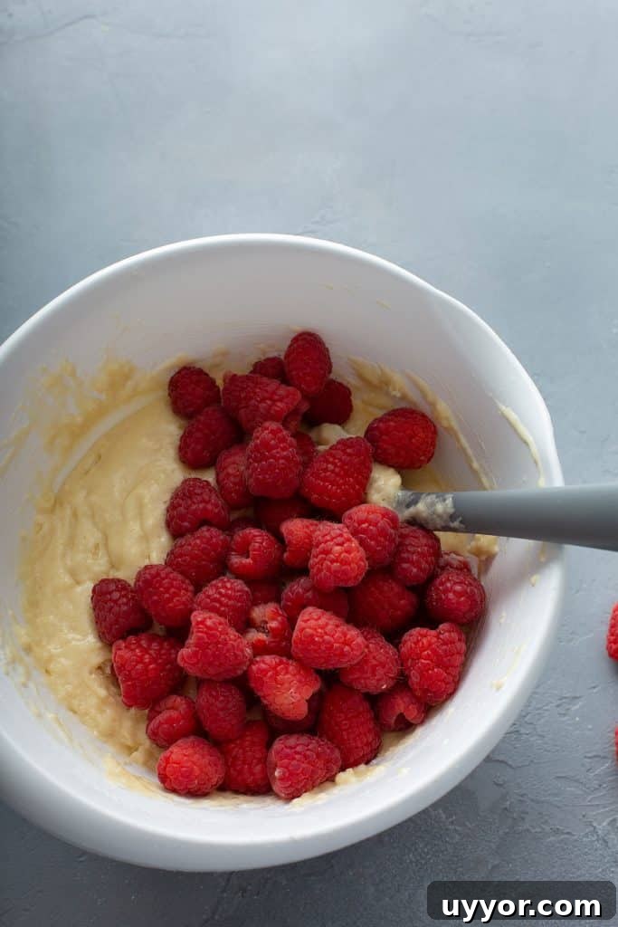 raspberries over the muffin batter