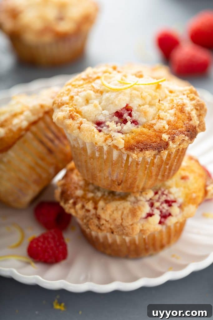 Stack of raspberry muffins on a plate