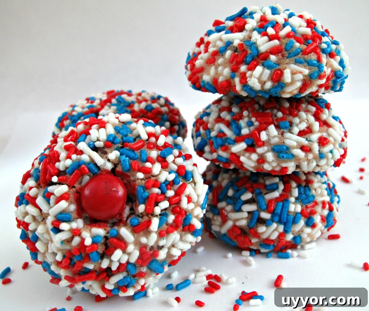 Melted Ice Cream Cookies in patriotic sprinkles. Cookies coated in red, white, blue patriotic jimmies sprinkles.
