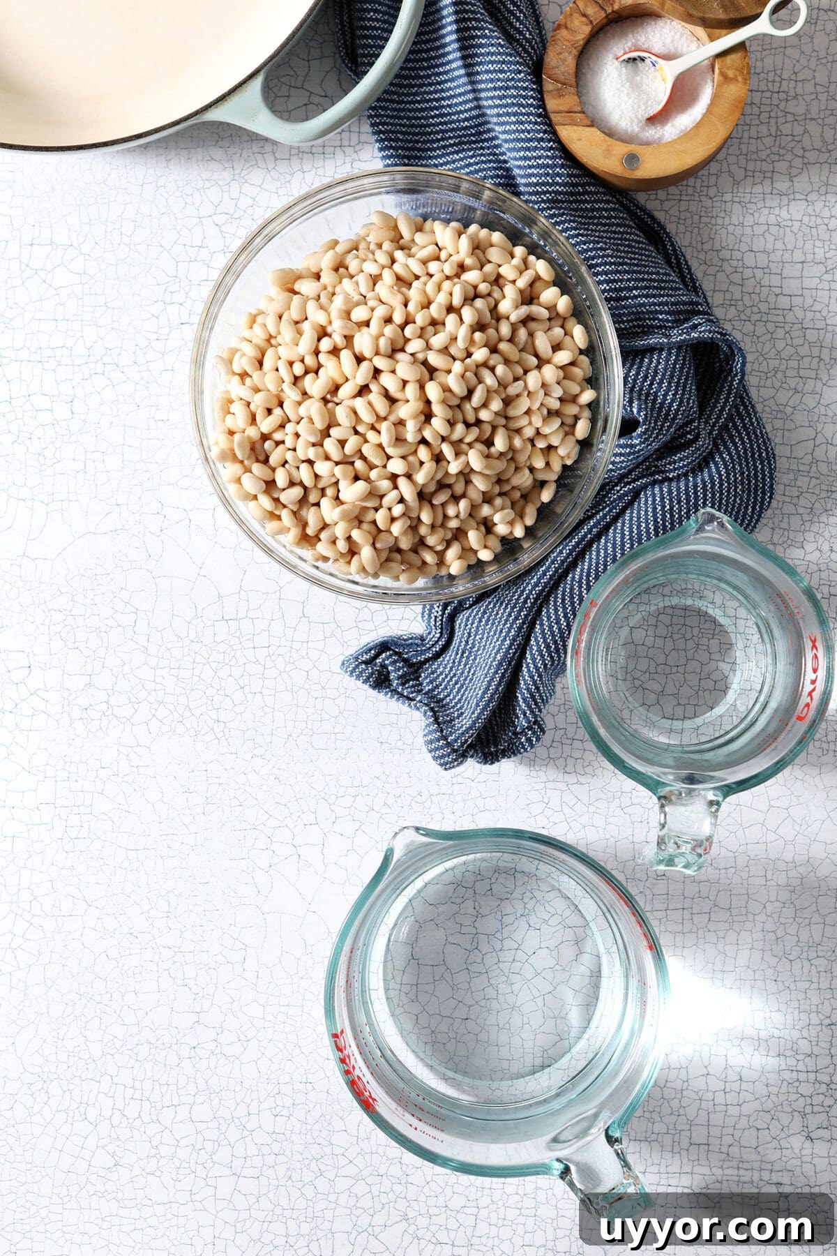 Bowls holding beans and water to make homemade baked beans