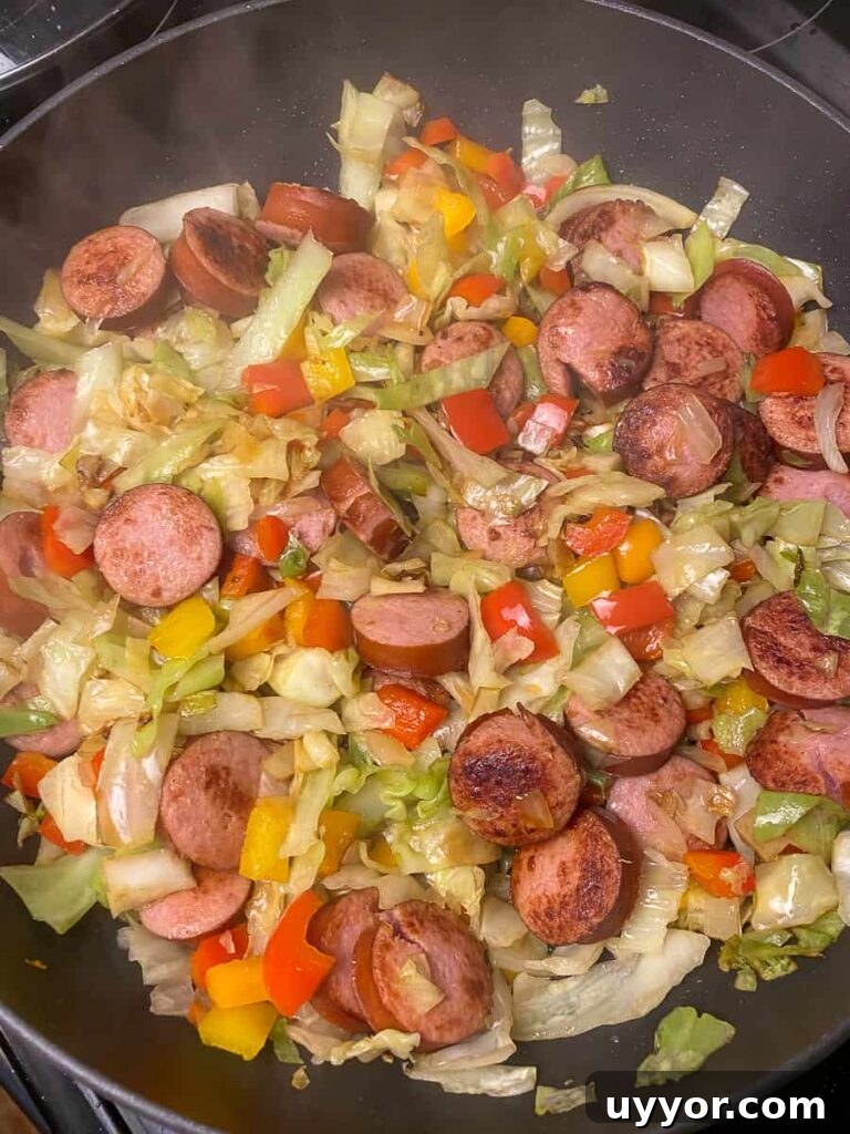 Savory Kielbasa and Cabbage Skillet Recipe for Weeknight Dinners 11 Fried cabbage on the stove top